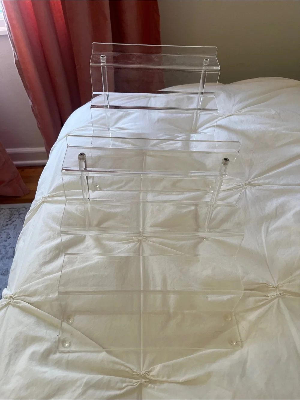 Set of two clear plastic makeup organizers or crystal / trinket display racks